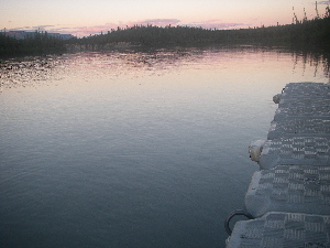 Doc at Virgia Falls campsite.  Looking down towards Sluice box rapids.