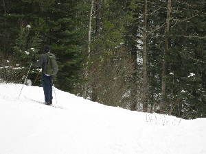 Sundog Trail: Mike checking out the drop down into the valley.